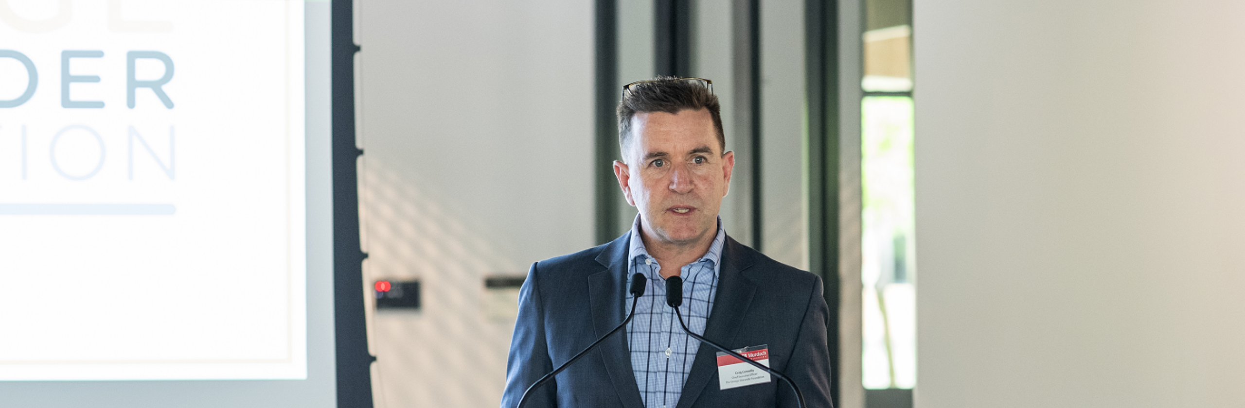 Man standing at a lectern