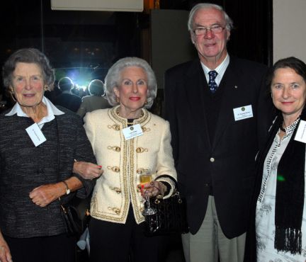 Four elderly people standing next to each other