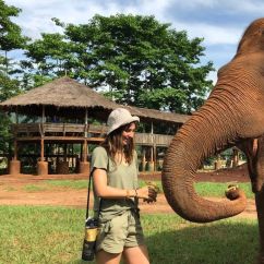 Kayla Rowe, Murdoch University Scholar. Young woman standing next to an Asian Elephant.