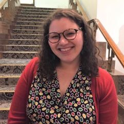 Michelle Ginnivan, RMIT University alumna. Woman with brown hair, wearing a polka dot top smiling.