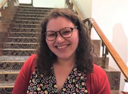 Michelle Ginnivan, RMIT University alumna. Woman with brown hair, wearing a polka dot top smiling.