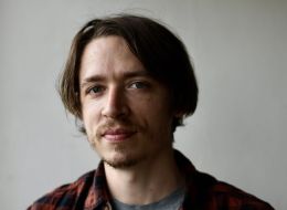 Shane Wiechnik, ISSI fellow. Headshot of man with brown hair and eyes wearing a flannel shirt. 