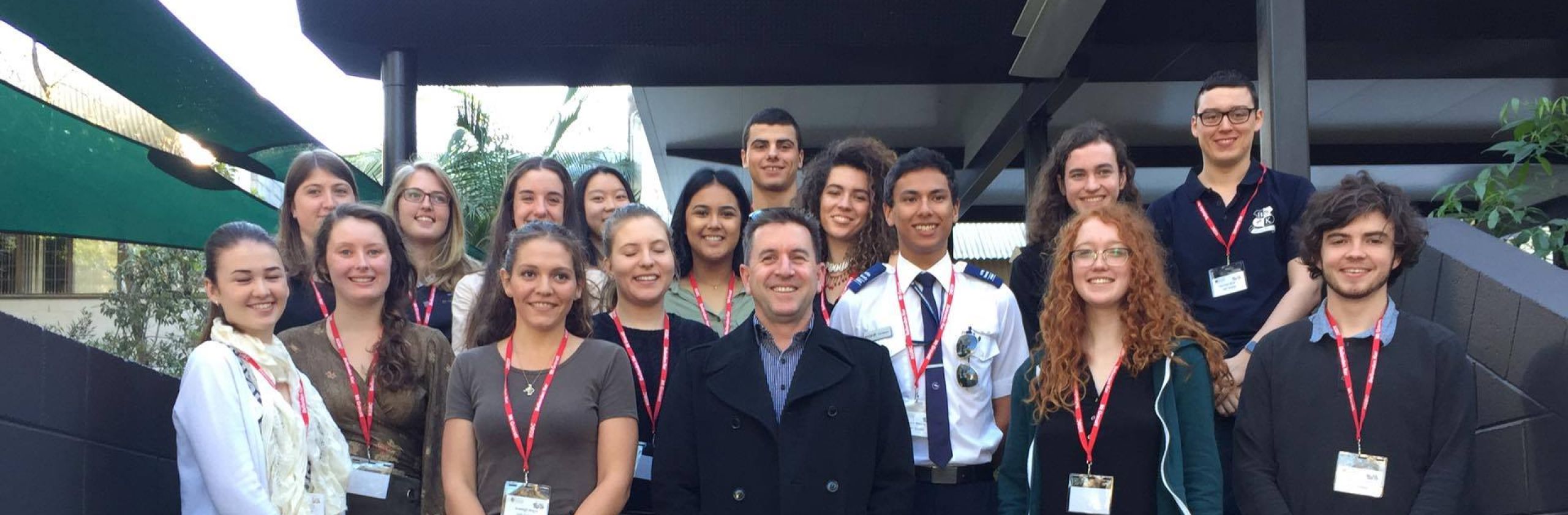 A group of Griffith Uni students standing on steps with the GAF CEO