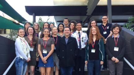 A group of Griffith Uni students standing on steps with the GAF CEO