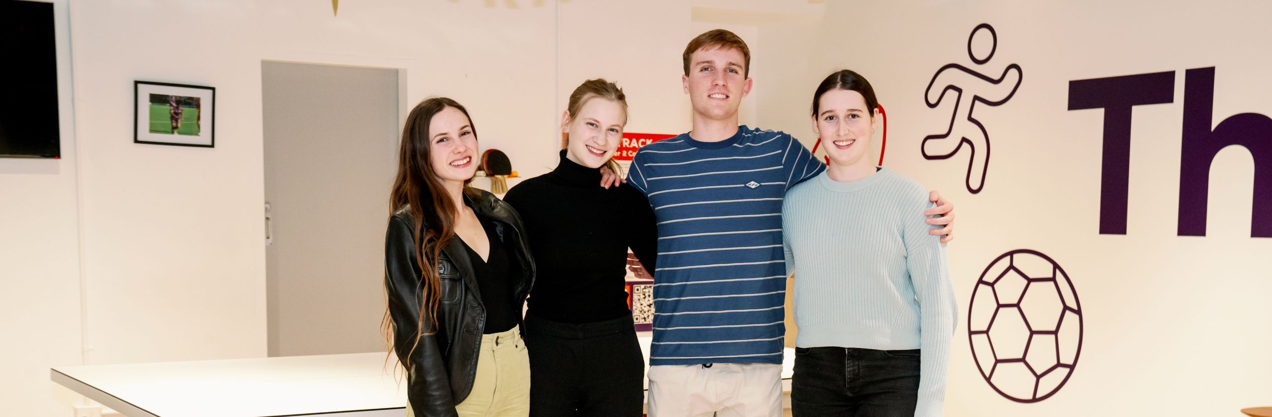 Four GAF scholars posing at camera.