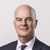 Headshot of middle-aged man in a suit