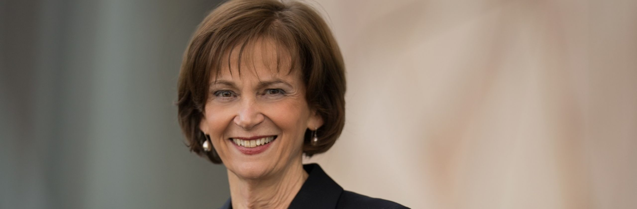 Hedshot of middle-aged woman wearing a suit