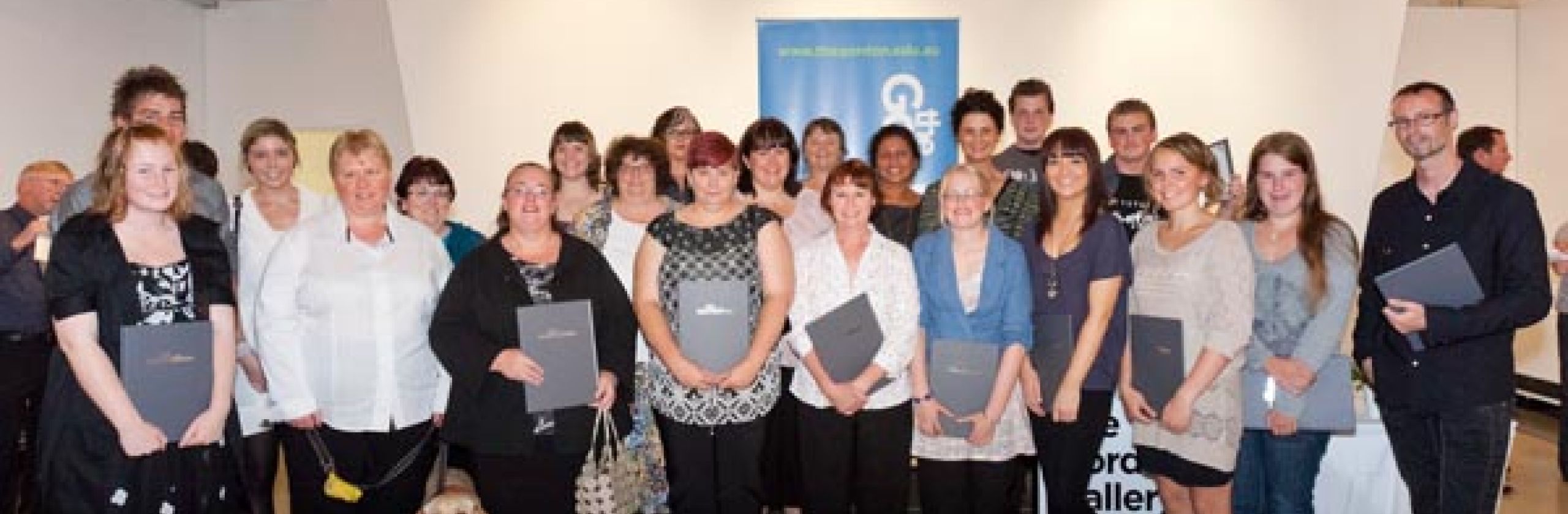 About 20 scholars from The Gordon holding their scholarship certificates