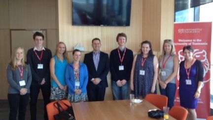 Seven UTAS students receiving their scholarship awards from GAF CEO