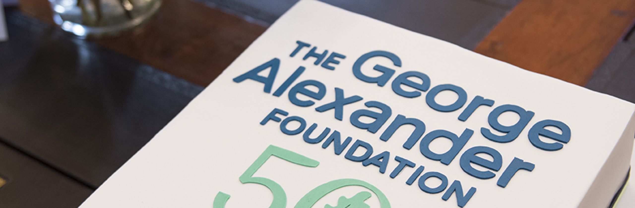 Cake with The George Alexander Foundation's 50th Anniversary commemorative logo