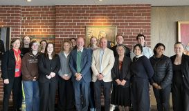 A group of 16 unviersity students with representatives from Deakin and the Foundation