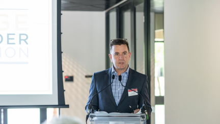Man standing at a lectern