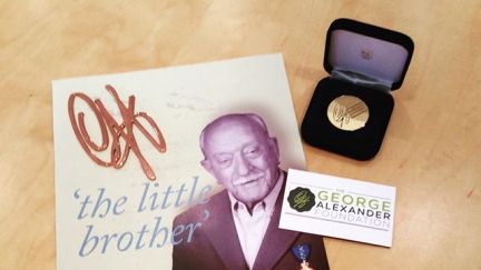 A copy of the Little Brother biography of George Alexander plus a GAF medallion
